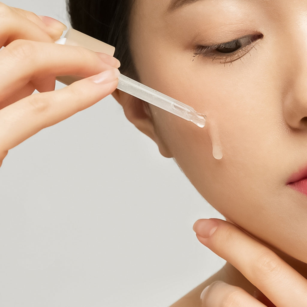 serum one drop on korean woman face